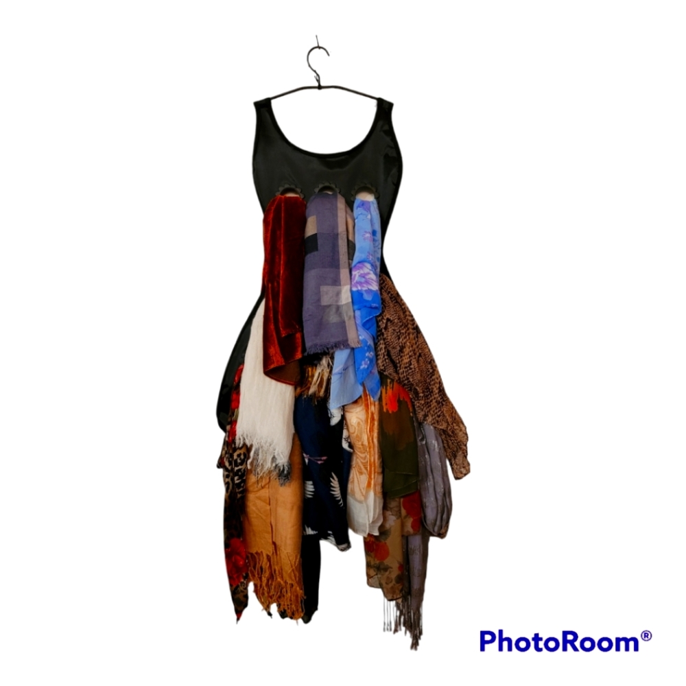 14 scarves, in varied sizes, colors, and fabrics.